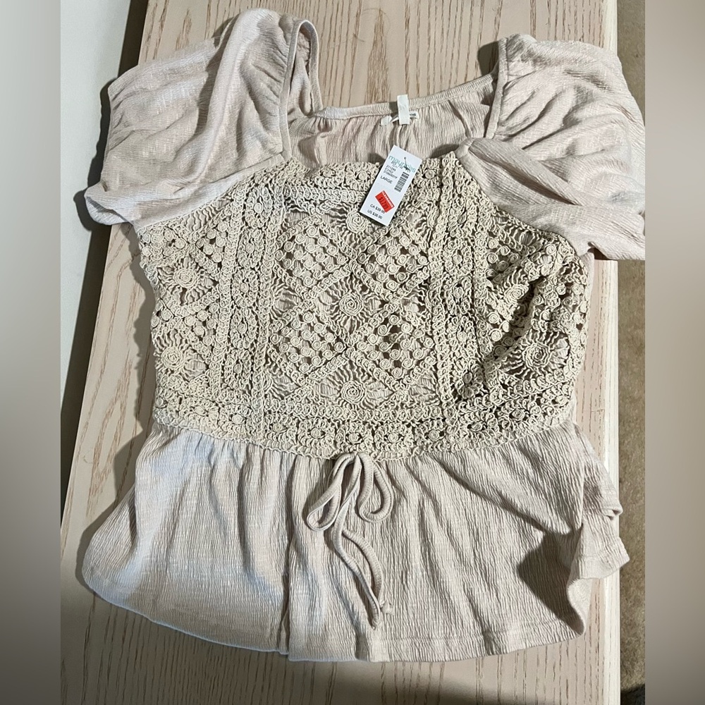 Short sleeve cream color shirt from Maurice’s -brand new never worn.